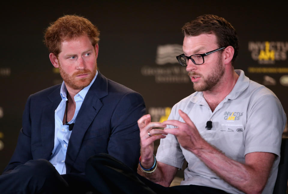 ORLANDO, FL - MAY 08:  Prince Harry and Royal Marine veteran JJ Chalmers talk at a Symposium of Invisable Wounds at the Shades of Green resort at Invictus Games Orlando 2016 at ESPN Wide World of Sports on May 8, 2016 in Orlando, Florida. Prince Harry, patron of the  Invictus Games Foundation is in Orlando ahead of the opening of Invictus Games which will open on Sunday. The Invictus Games is the only International sporting event for wounded, injured and sick servicemen and women. Started in 2014 by Prince Harry the Invictus Games uses the power of Sport to inspire recovery and support rehabilitation.  (Photo by Chris Jackson/Getty Images for Invictus Games)