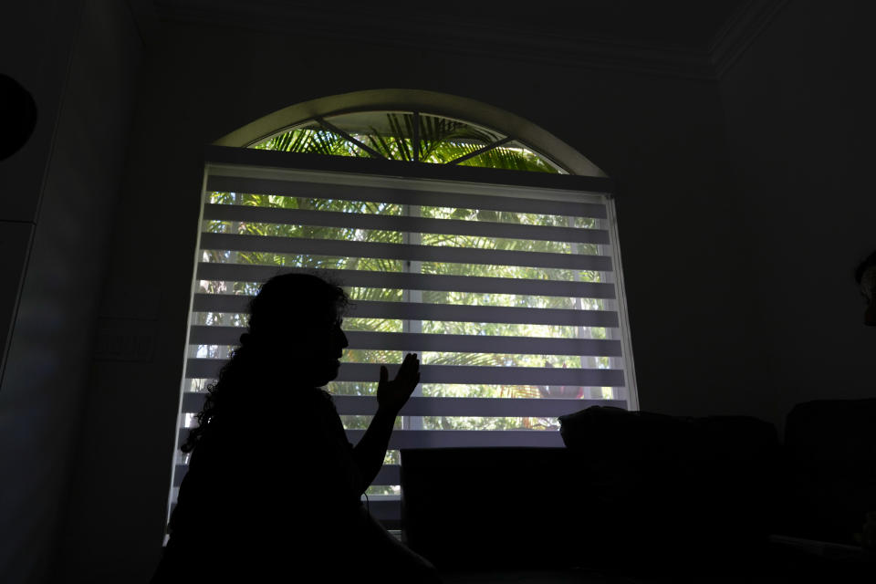 A 45-year-old Mexican woman who preferred to be identified only by her last name Hernandez for fear of deportation, talks about how she came to the U.S. 25 years ago and has three U.S.-born children, but lives in constant fear of deportation because she cannot obtain a work permit, in Miami, Tuesday, Nov. 7, 2023. "For a humanitarian reason, they are giving opportunities to those who are arriving, and what is the humanity with us?" said the woman. (AP Photo/Rebecca Blackwell)