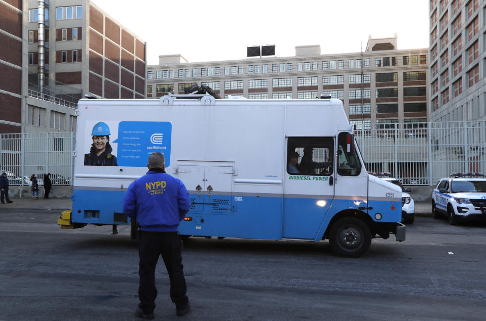 A Con Edison truck drives past the Metropolitan Detention Center, a federal prison where inmates have been without heat, hot water, electricity and flushing toilets since earlier in the week due to an electrical failure, including during the recent frigid cold snap, Sunday, Feb. 3, 2019, in New York. (AP Photo/Kathy Willens)
