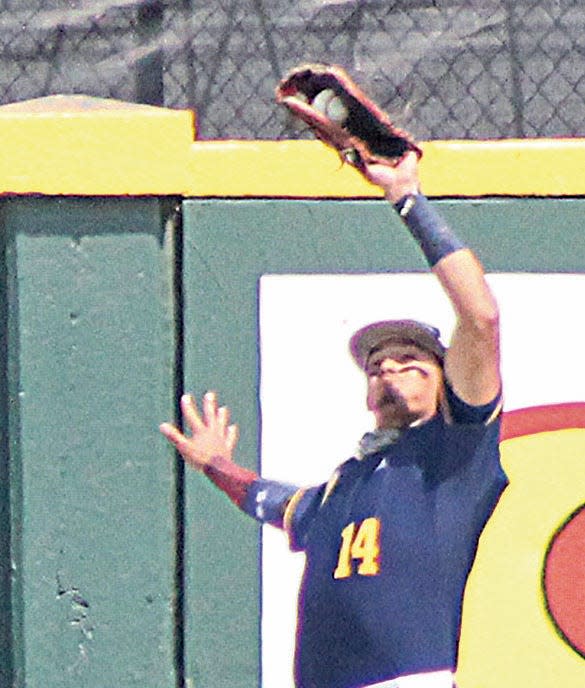 Oklahoma Wesleyan University's Jesus Rojas makes a catch just in front of the wall during Eagle action two years ago in its run to the NAIA World Series.