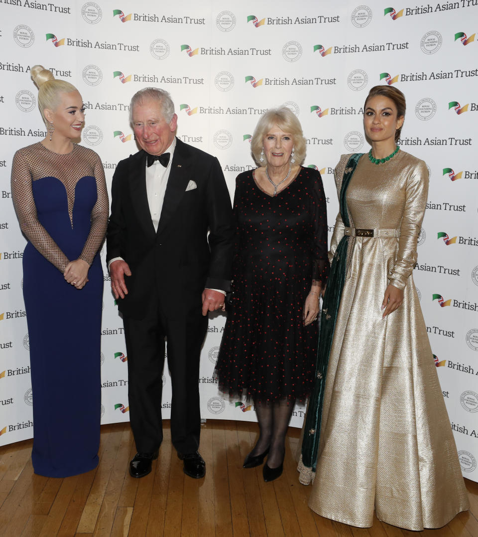 The Prince of Wales and the Duchess of Cornwall with Indian businesswoman Natasha Poonawalla (right) and musician Katy Perry (left), as they attend a reception for supporters of the British Asian Trust at Banqueting House, Whitehall, London.