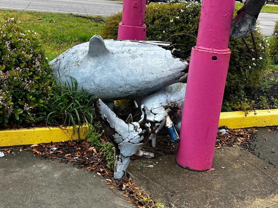 A pair of sharks that once served as a fountain at a beachwear store near the Myrtle Beach State Park, lay in ruins at the base of the sign for what is now Sugar Kingdom. In the early 2000s, Bob Duato built giant sharp sculptures and other theme sculptures for Myrtle Beach area businesses. March 28, 2024.