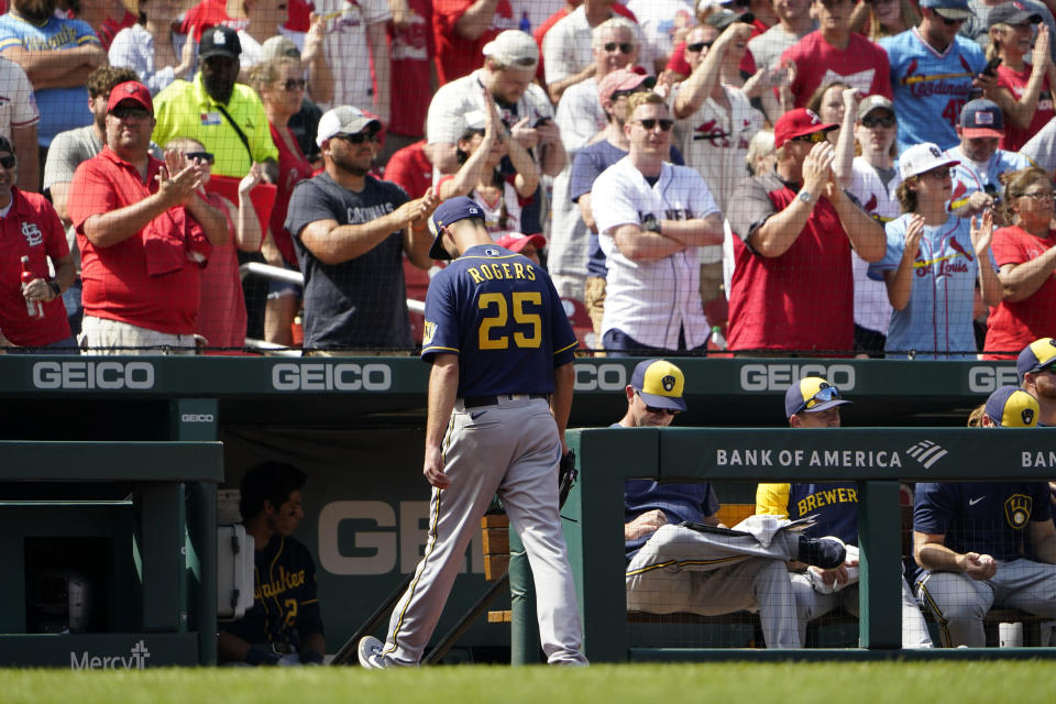 Milwaukee Brewers relief pitcher Taylor Rogers walks off the field after being removed during the eighth inning of a baseball game against the St. Louis Cardinals Sunday, Aug. 14, 2022, in St. Louis. (AP Photo/Jeff Roberson)