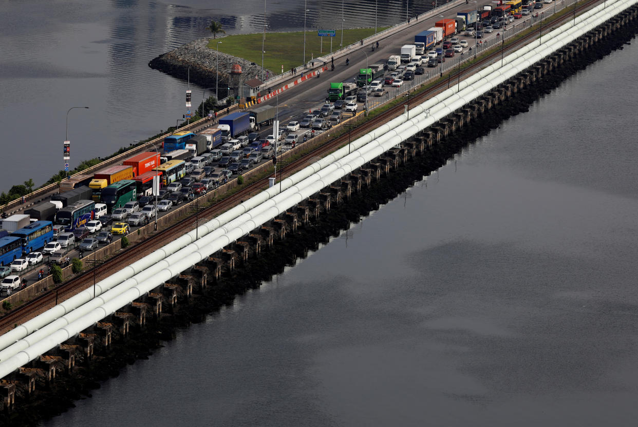 Pipes carrying water from Malaysia to Singapore run alongside the causeway towards the Woodlands Checkpoint in Singapore July 20, 2018. REUTERS/Edgar Su