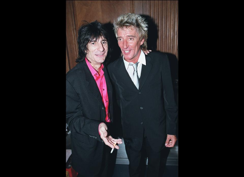 Pictured: Ronnie Wood and Rod Stewart of The Faces  LONDON - 2000: Musician's Ronnie Wood (L) from the Rolling Stones and Rod Stewart party at Tramp nightclub to celebrate it's 30th anniversary in St James, London. (Photo by Dave Hogan/Getty Images)