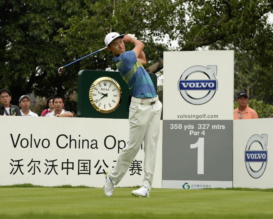 In this photo released by OneAsia, Li Haotong of China watches his shot during the third round of the Volvo China Open at Genzon Golf Club in Shenzhen, southern China, Saturday, April 26, 2014. (AP Photo/OneAsia, Paul Lakatos) NO LICENSING