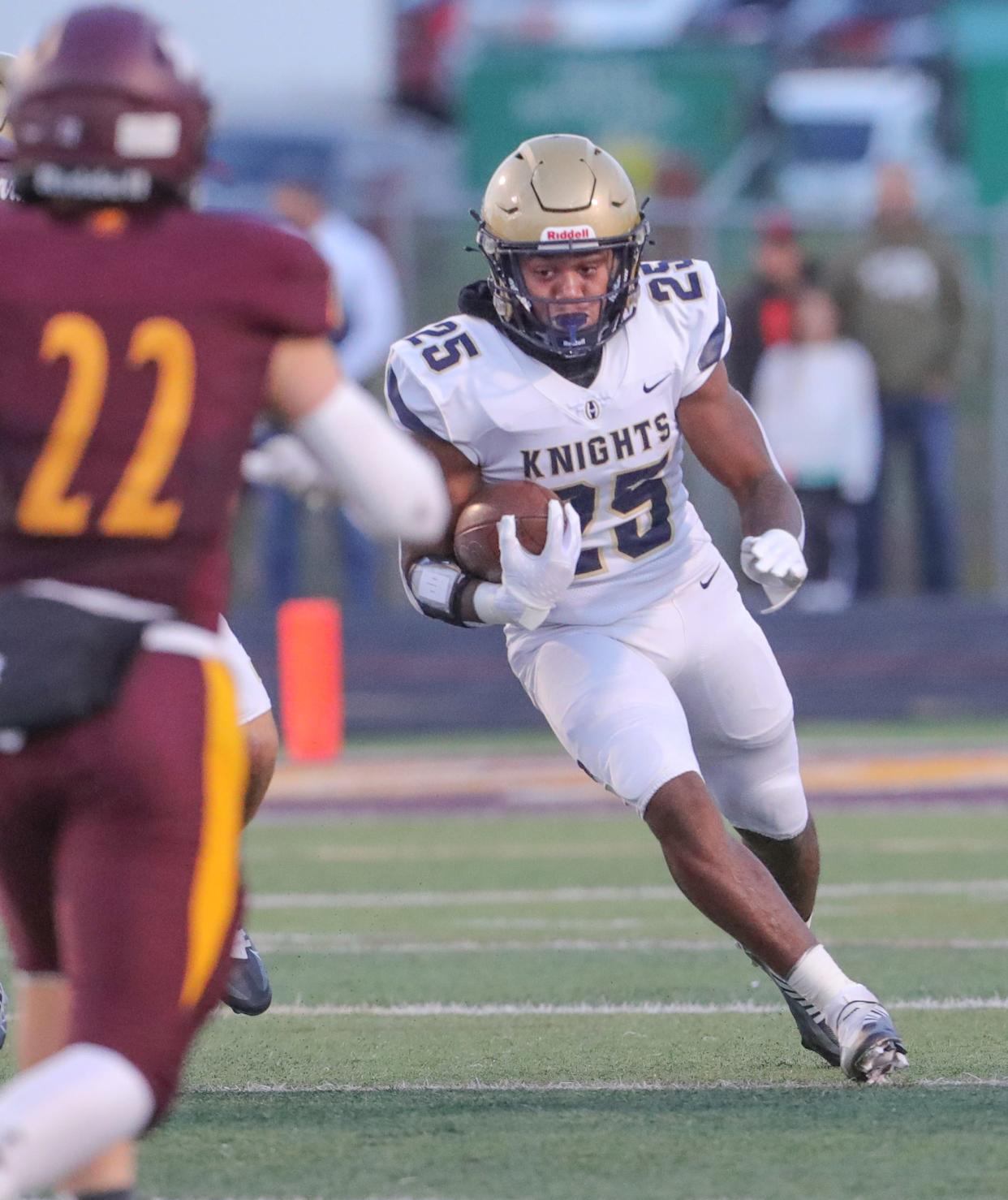 Hoban running back Caleb Jones carries the ball during the first quarter against Walsh Jesuit on Friday, Sept. 23, 2022 in Cuyahoga Falls.