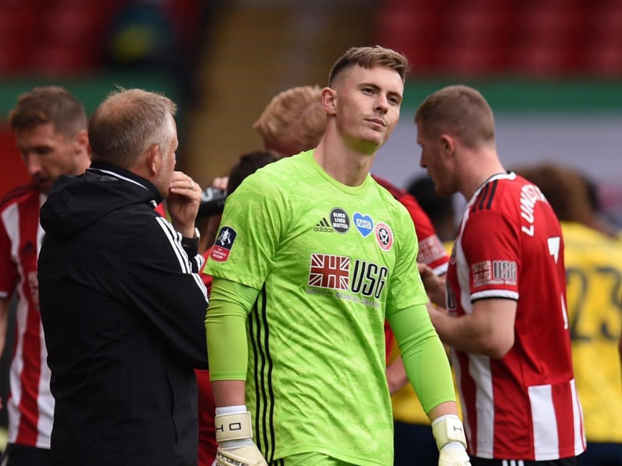 Sheffield United's Dean Henderson shows his frustration after being beaten from the spot: POOL/AFP via Getty Images