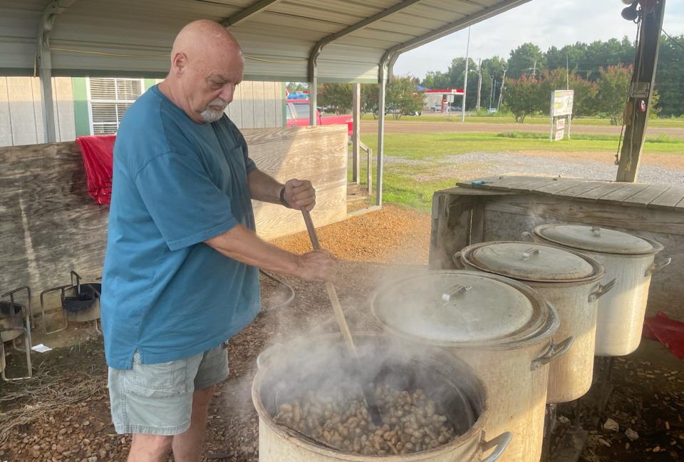 Steve Blackwell stirs boiling peanuts at C&B Farms'  Crystal Springs location. C&B Farms shared its method for boiling traditional as well as spicy Cajun boiled peanuts.