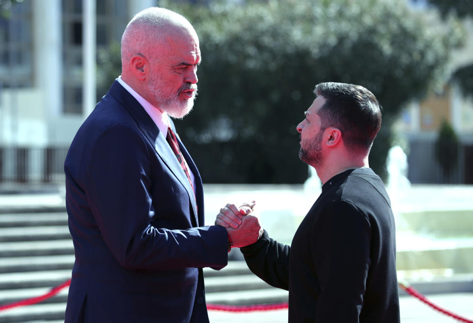 Albanian Prime Minister Edi Rama, left, and Ukrainian President Volodymyr Zelenskyy shake hands as they wait other officials for the summit of Southeastern European countries on peace in Tirana, Albania, Wednesday, Feb. 28, 2024. Ukraine's president will co-host a summit with Albania's government on Wednesday that is meant to encourage further support for Kyiv by southeastern European countries, as signs of fatigue grow two years after Russia's full-scale invasion. (AP Photo/Armando Babani)