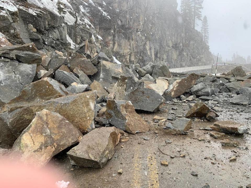 Rock is strewn across Highway 50 after crews used explosives to break up a massive boulder that fell onto the roadway near Echo Summit.