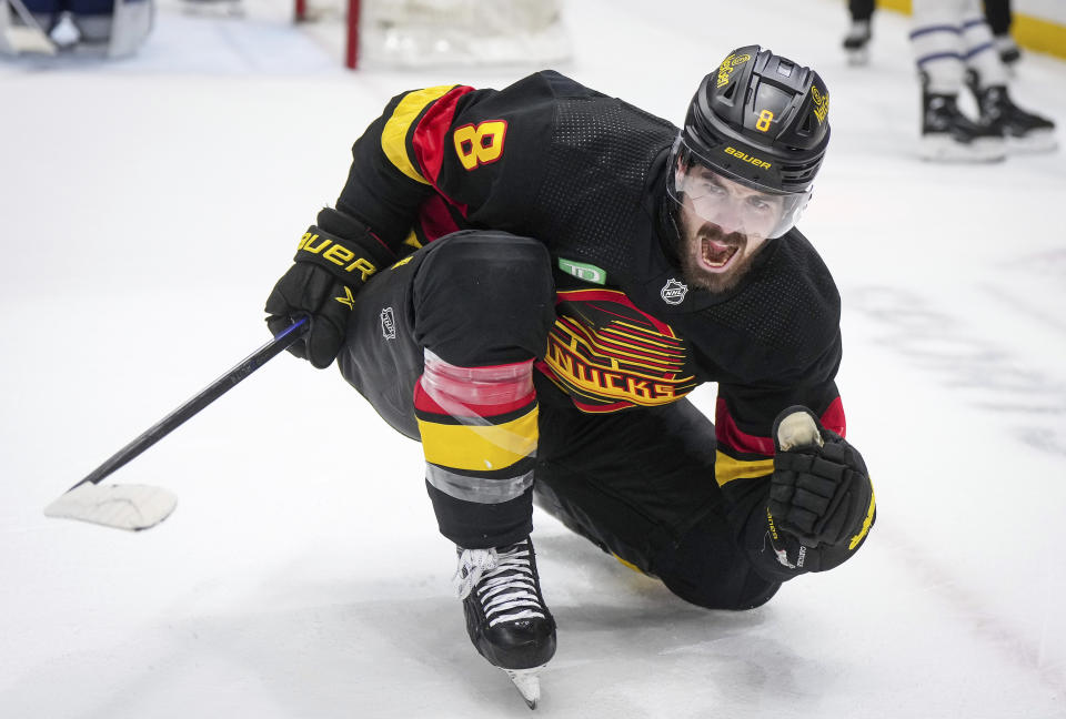 Vancouver Canucks' Conor Garland celebrates after his second goal against the Toronto Maple Leafs, during the second period of an NHL hockey game in Vancouver, British Columbia, Saturday, Jan. 20, 2024. (Darryl Dyck/The Canadian Press via AP)