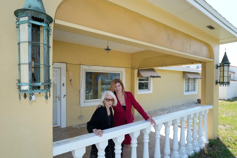 Nina Lavigna stands alongside her daughter Lisa Macci at her home which is facing condemnation after storms Ian and Nicole.