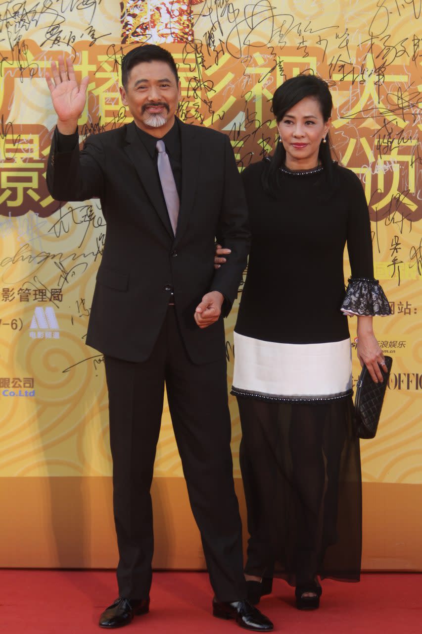 BEIJING, CHINA - AUGUST 28: (CHINA OUT) Hong Kong actor Chow Yun-fat and his wife Jasmine Tan arrives at red carpet of the 14th Huabiao Film Awards at Beijing Exhibition Center on August 28, 2011 in Beijing, China. (Photo by Visual China Group via Getty Images)