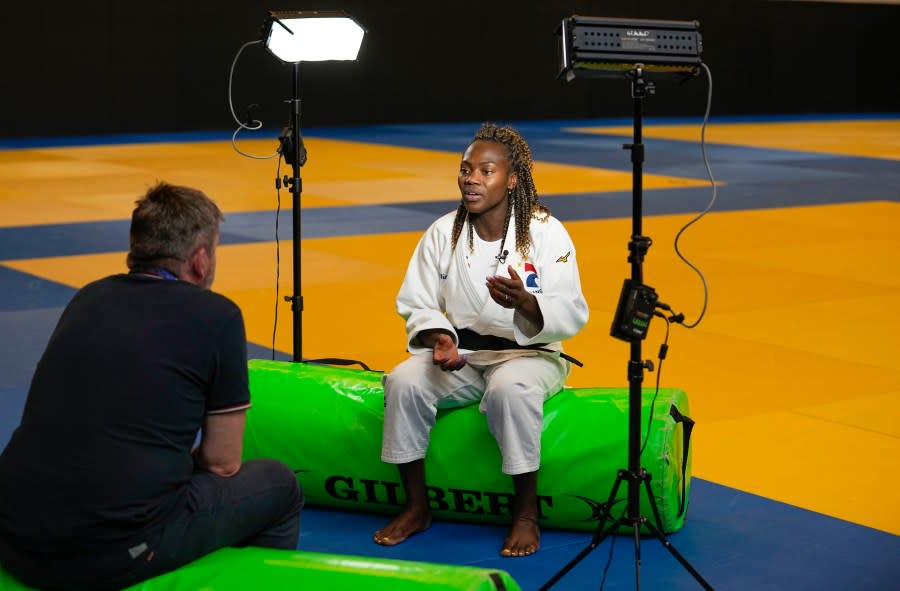 French judoka Clarisse Agbegnenou gestures during an interview with The Associated-Press in Paris, Wednesday, June 14, 2023. Breast-feeding and high-performance sports were long an almost impossible combination for women athletes, faced for decades with the cornelian choice of career or motherhood, because it was so tough to have both. But that’s becoming less true ahead of the first Summer Games where men and women will compete in equal numbers and with pioneering super-mums showing that it’s possible (AP Photo/Michel Euler)