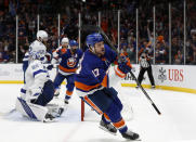 New York Islanders left wing Matt Martin (17) celebrates after scoring a goal against Tampa Bay Lightning goaltender Andrei Vasilevskiy (88) during the second period of Game 4 of an NHL hockey Stanley Cup semifinal, Saturday, June 19, 2021, in Uniondale, N.Y. (AP Photo/Jim McIsaac)