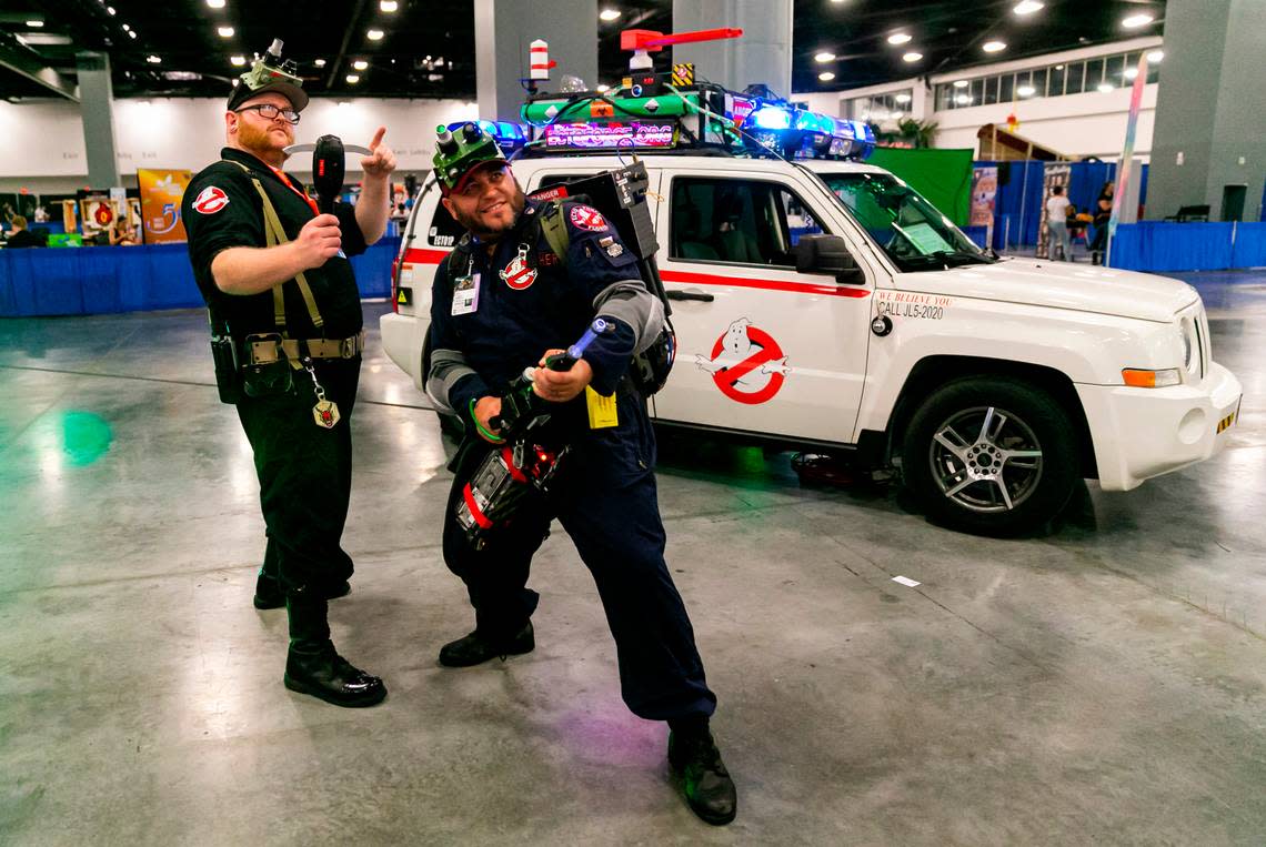 Tim “Crispy” Fries, left, and Tyler Pitcher cosplay as Ghostbusters during Florida Supercon.