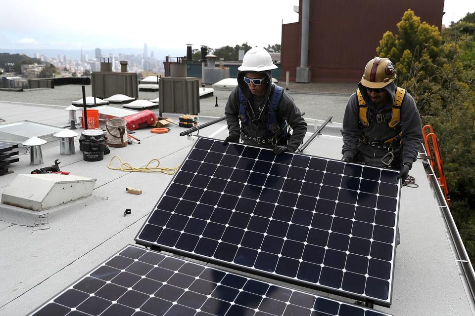 <p>Luminalt solar installers set up solar panels on the roof of a home in San Francisco, California. <a href="https://www.nytimes.com/2018/05/09/business/energy-environment/california-solar-power.html" rel="nofollow noopener" target="_blank" data-ylk="slk:The state now requires;elm:context_link;itc:0;sec:content-canvas" class="link ">The state now requires</a> that most new homes built after January 2020 have solar panels. This is a huge environmental step for the state, and is expected to lower energy bills for homeowners. </p>