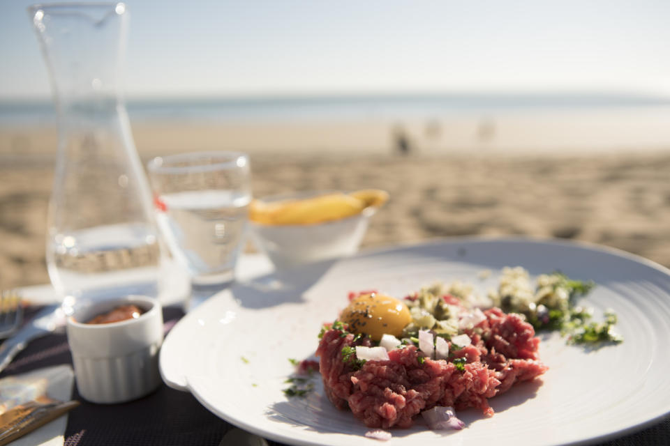 Steak tartare on the beach. Photo: Getty