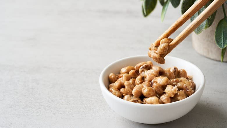 natto in bowl with chopsticks