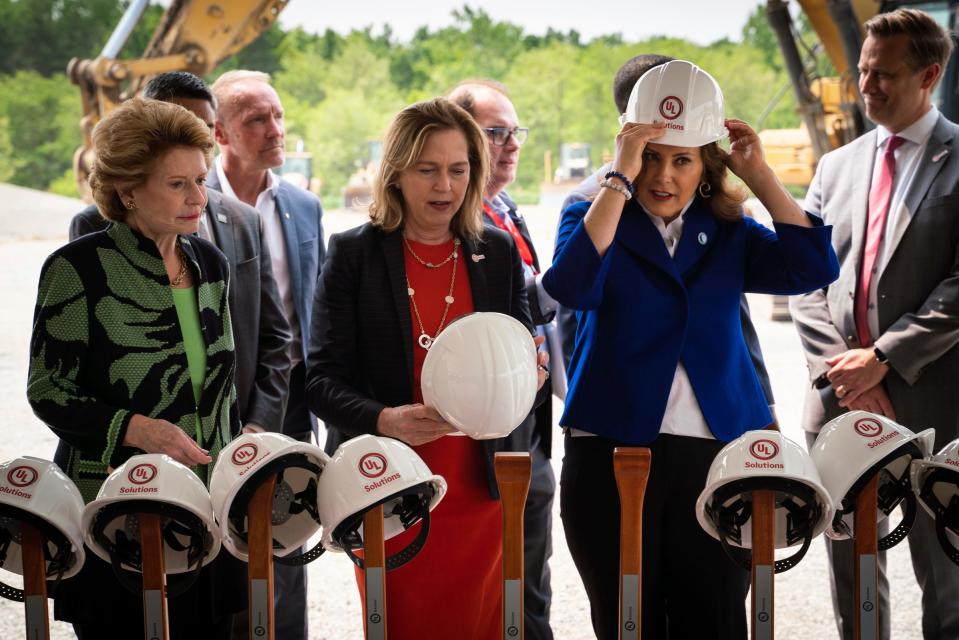 U.S. Sen. Debbie Stabenow, D-Michigan, left, Jennifer Scanlon, president and CEO of UL Solutions, and Michigan Gov. Gretchen Whitmer put on hardhats during a ceremony for UL Solutions North America Advanced Battery Laboratory at the site location in Auburn Hills on Monday, June 5, 2023.