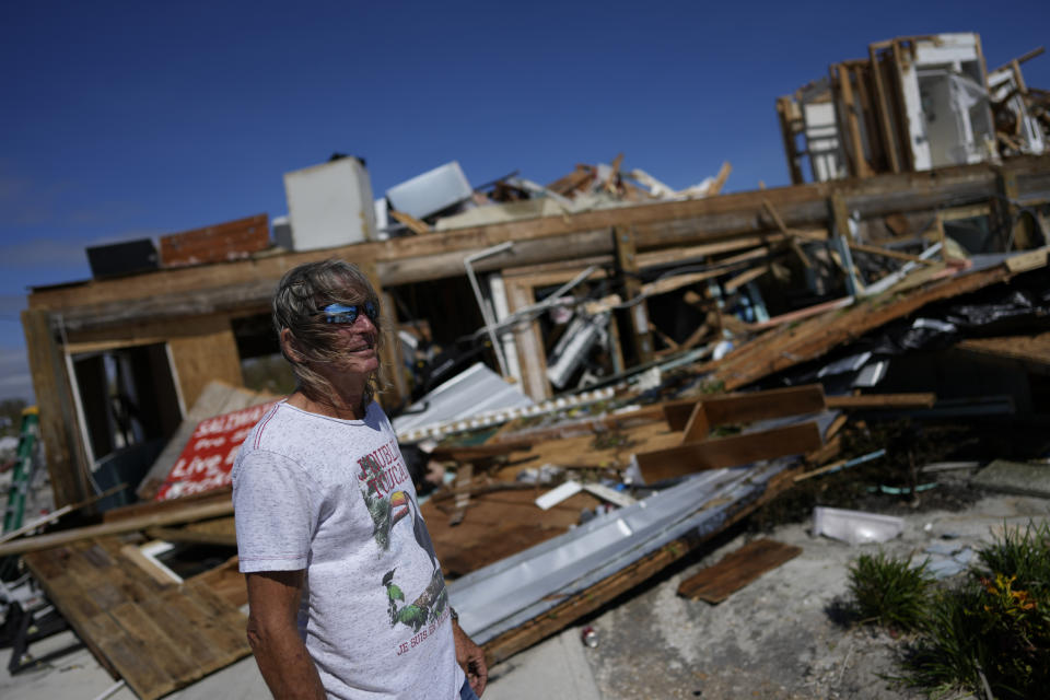 Robert Leisure surveys his business, Getaway Marina, which was destroyed during the passage of Hurricane Ian, in Fort Myers Beach, Fla., Thursday, Sept. 29, 2022. (AP Photo/Rebecca Blackwell)