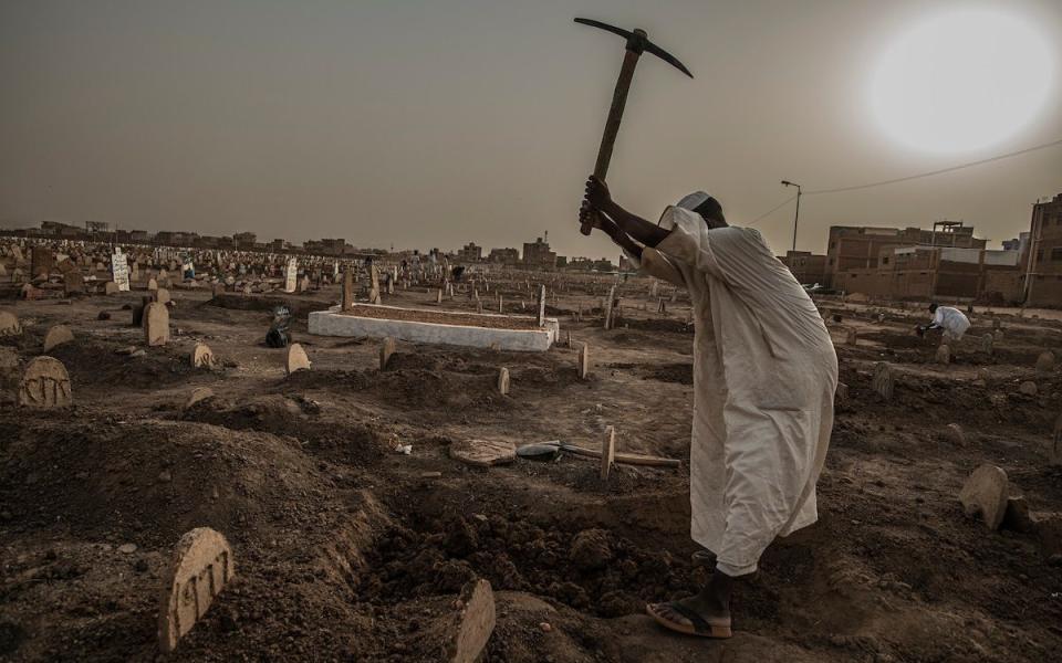 A grave digger prepares Al Sahafa Cemetery for more Covid dead - Simon Townsley for The Telegraph