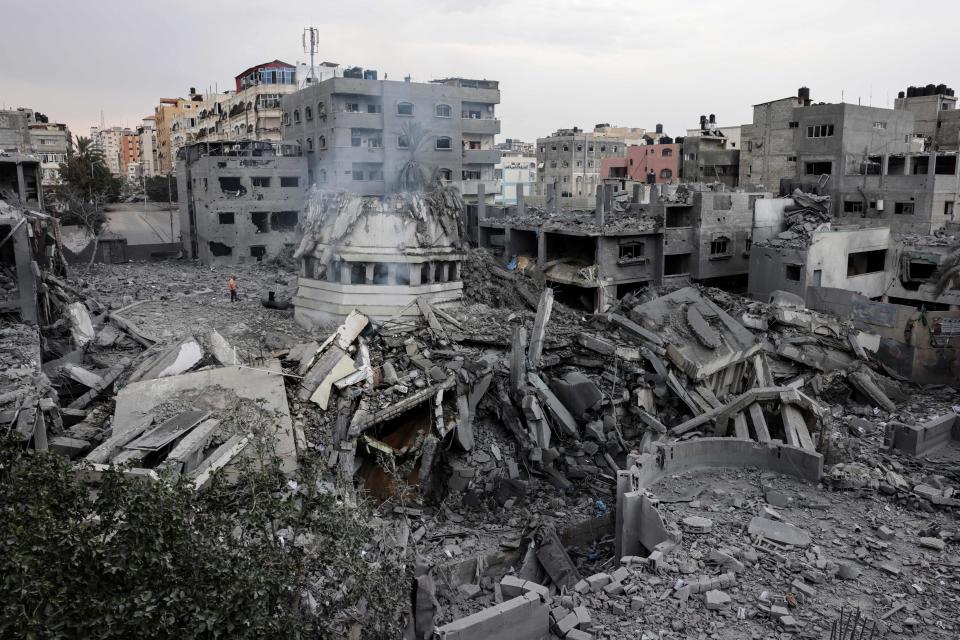 Palestinians inspect the destruction around Ahmed Yassin mosque, which was levelled by Israeli airstrikes, in Gaza City early on Oct. 9. (Photo by Mohammed Abed/AFP via Getty Images)