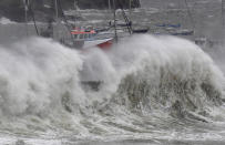 Devon didn't escape the storm, which saw large waves crash over the seawall in Brixham. (Reuters)