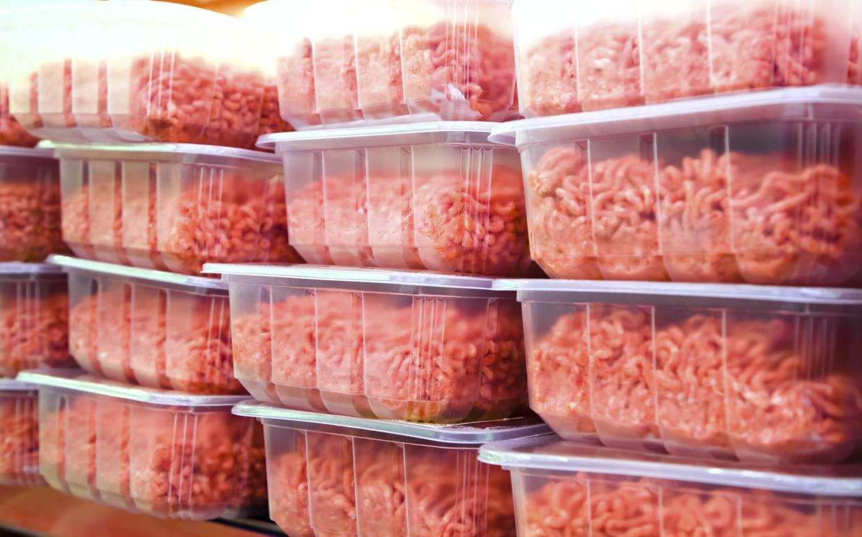 Ground Beef in plastic containers at a Meat Market