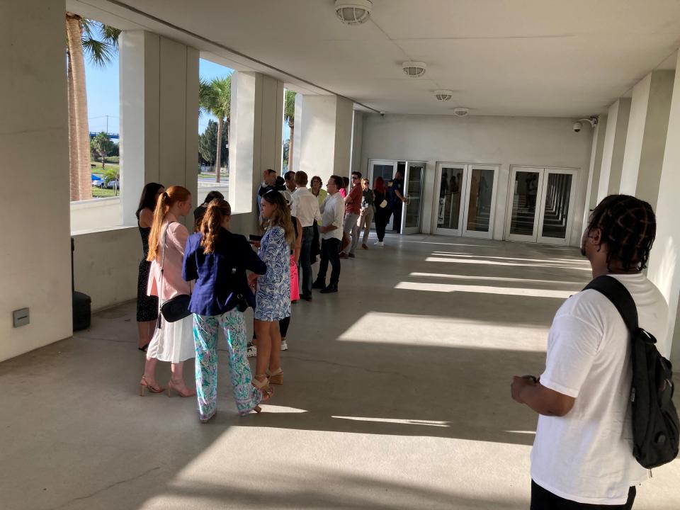 Citizens and media interested in attending a pretrial hearing for former President Donald Trump and codefendant Waltine "Walt" Nauta on Tuesday, July 18, 2023, line up at the Alto Lee Adams Sr. U.S. Courthouse on U.S. 1 at Orange Avenue in Fort Pierce, Fla.