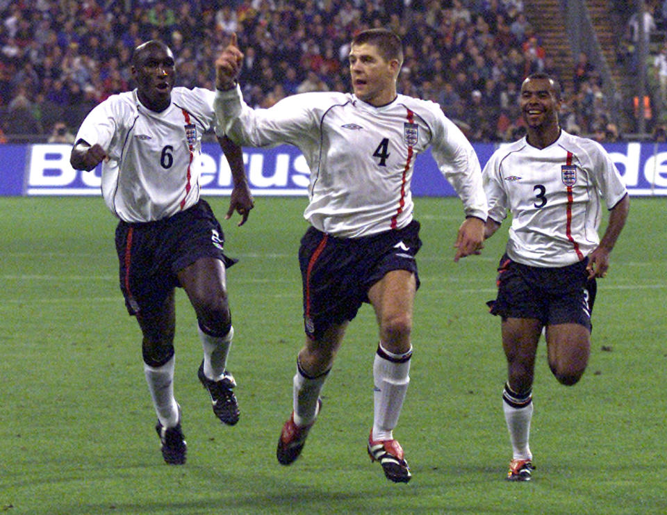 FILE - In this Saturday, Sept. 1, 2001 file photo, England's Steven Gerrard, center, celebrates scoring a goal as England beat Germany 5-1 at the Olympic Stadium in Munich, Germany. On German soil, England produced a signature win of Sven-Goran Eriksson's tenure as coach — and it's greatest performance against a unified Germany team. (AP Photo/Christof Stache, File)