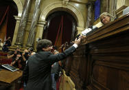 <p>Catalan President Carles Puigdemont casts his ballot in a vote on independence in the Catalan parliament in Barcelona, Spain, Friday, Oct. 27, 2017. (Photo: Manu Fernandez/AP) </p>