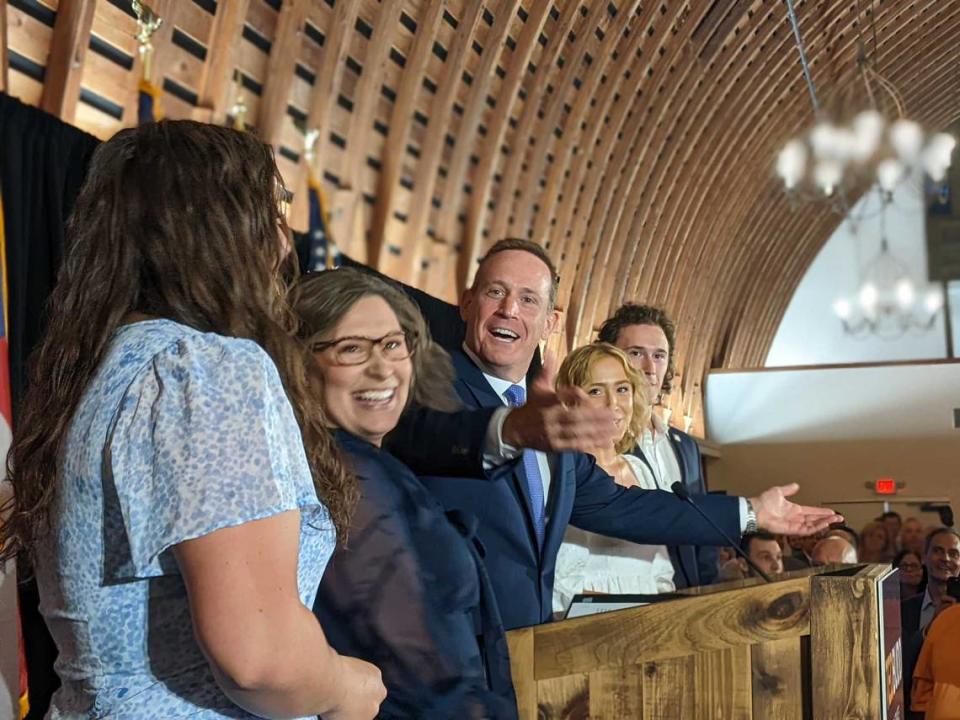 U.S. Rep. Ted Budd greets the crowd at an Election Night event in Bermuda Run, North Carolina, after winning the Republican nomination for U.S. Senate on Tuesday, May 17, 2022. His wife, Amy Kate, and the couple’s three children joined Budd during his victory speech.