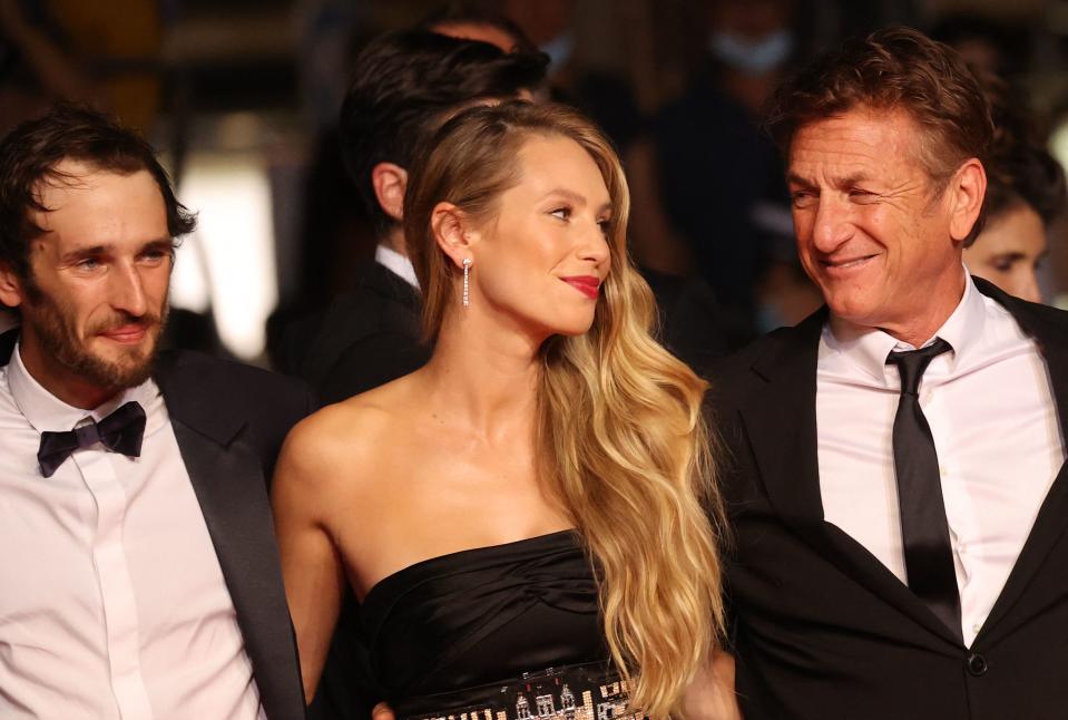 TOPSHOT - US actor and director Sean Penn (R) arrives with his son US actor Hopper Jack Penn (L) and daughter US actress Dylan Penn for the screening of the film 