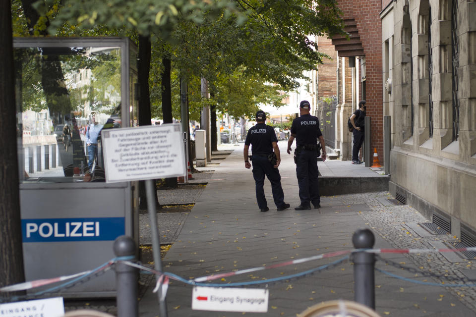 Police patrol in front of the 'New Synagogue' at Oranienburger Strasse in Berlin, Germany, Thursday, Sept. 24, 2020. Millions have be provided to enhance the security of Jewish sites, but some say it is still not enough and also doesn't tackle the question whether Jewish life can ever be normal and safe in Germany. (AP Photo/Markus Schreiber)