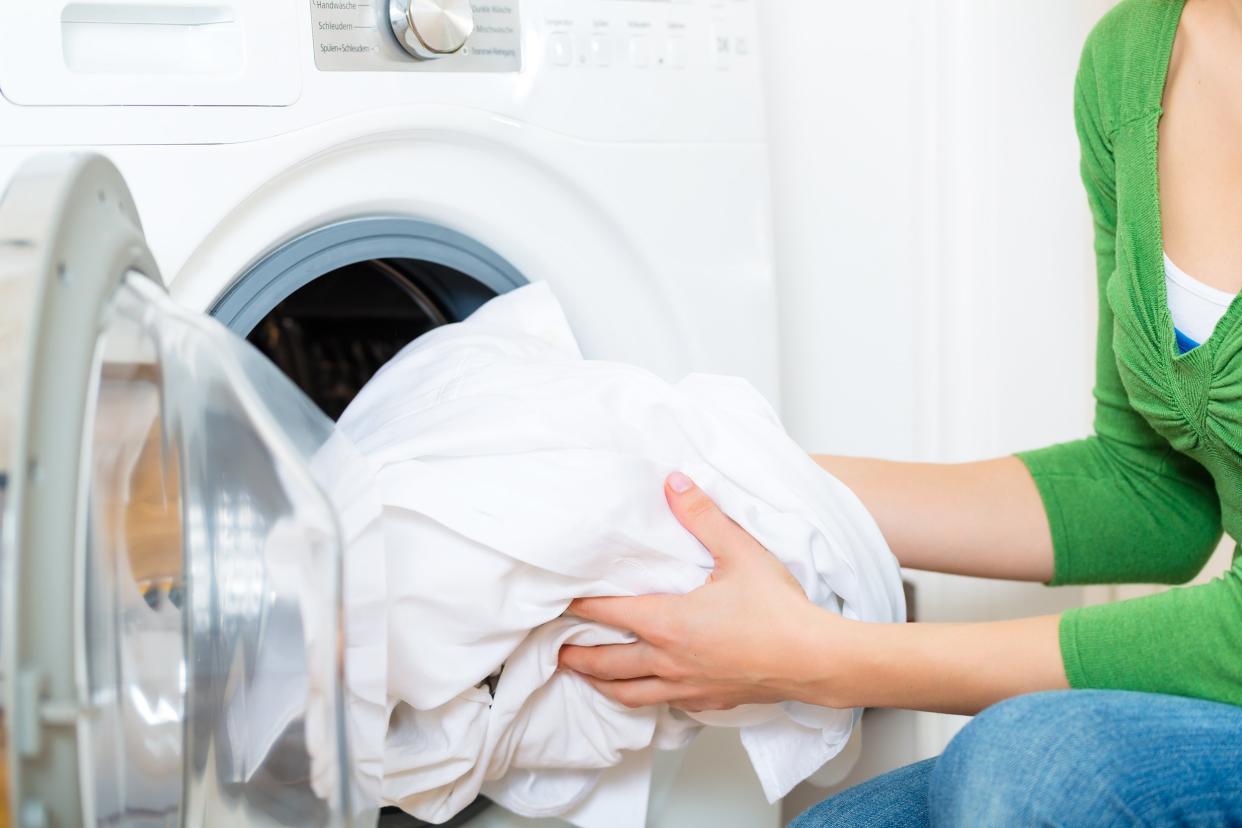 woman taking clothes out of the dryer