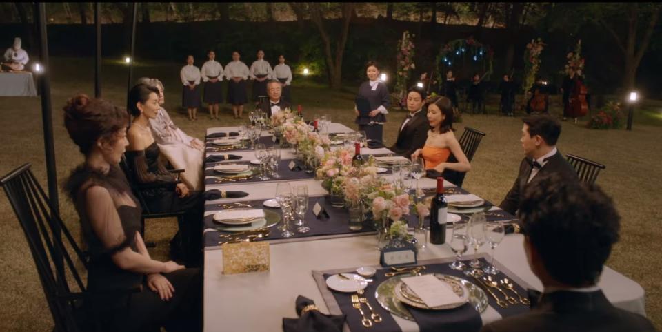 The aristocratic Han family sit down to an extravagant lawn dinner on their vast estate in Mine