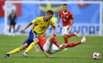 <p>Sweden’s Mikael Lustig, left, and Switzerland’s Granit Xhaka challenge for the ball during the round of 16 match between Switzerland and Sweden at the 2018 soccer World Cup in the St. Petersburg Stadium, in St. Petersburg, Russia, Tuesday, July 3, 2018. (AP Photo/Martin Meissner) </p>