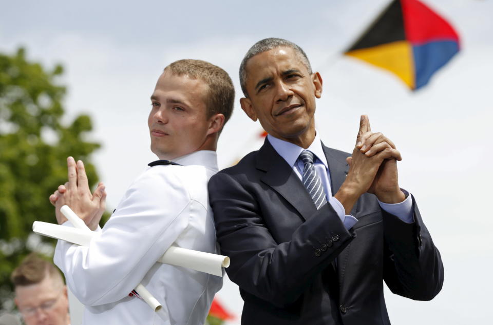 Graduate Robert McConnel asks Obama to strike a "James Bond" pose during the 134th Commencement Exercises of the United States Coast Guard Academy in New London, Connecticut, May 20, 2015.