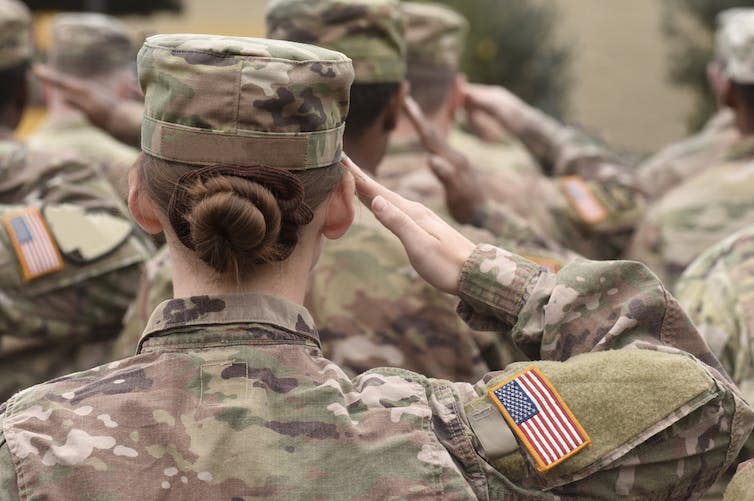 Female soldier saluting