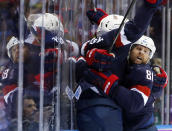 Team USA celebrates a second period goal against Russia during a men's ice hockey game at the 2014 Winter Olympics, Saturday, Feb. 15, 2014, in Sochi, Russia. (AP Photo/Mark Humphrey)