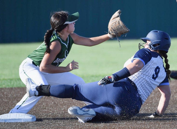 Lexi Durao, right, slides into base for Bartlesville High during varsity softball action against Muskogee on Aug. 14, 2023, in Bartlesville.
