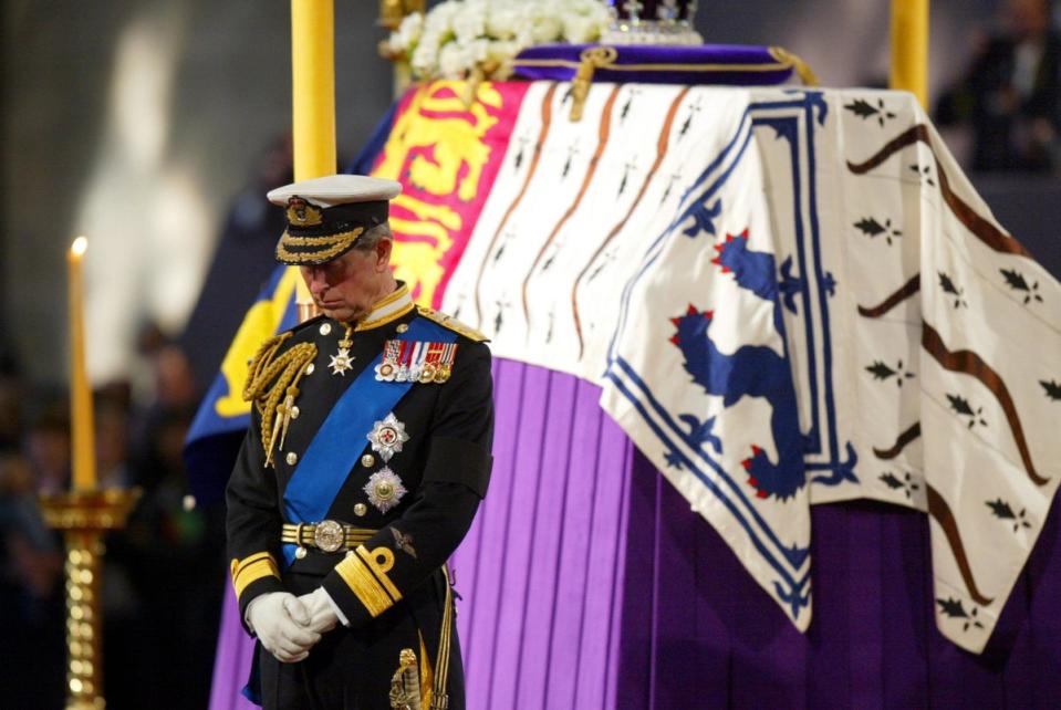 The Prince of Wales standing vigil beside the Queen Mother's coffin while it lay in-state at Westminster Hall in 2002 (PA)