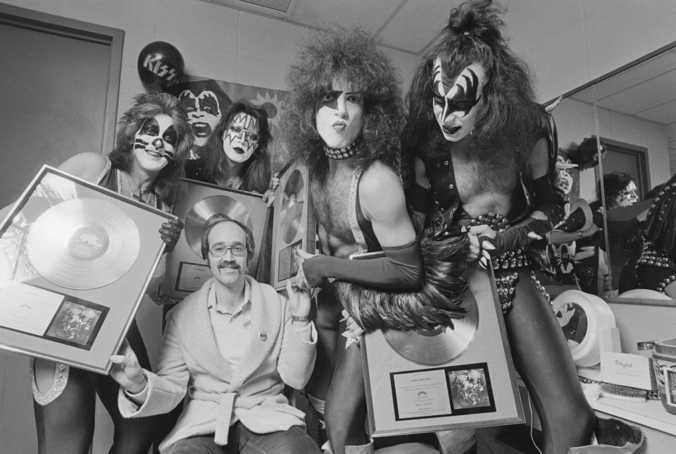 KISS and their gold records at the Nassau Coliseum in Uniondale, New York, December 31, 1975. (Photo by Fin Costello/Redferns) 