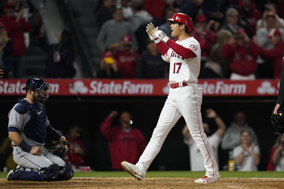 Los Angeles Angels designated hitter Shohei Ohtani (17) reacts as he runs the bases after hitting a grand slam home run during the seventh inning of a baseball game against the Tampa Bay Rays in Anaheim, Calif., Monday, May 9, 2022. Andrew Velazquez, Brandon Marsh, and Mike Trout also scored. (AP Photo/Ashley Landis)