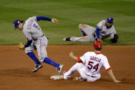 ST LOUIS, MO - OCTOBER 20: Elvis Andrus #1 of the Texas Rangers flips the ball to Ian Kinsler #5 for a fielders choice out to get Jaime Garcia #54 of the St. Louis Cardinals at second base to end the fifth inning during Game Two of the MLB World Series at Busch Stadium on October 20, 2011 in St Louis, Missouri. (Photo by Rob Carr/Getty Images)