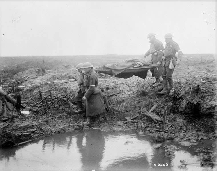 A wounded soldier is carried to an aid post during the Battle of Passchendaele.  