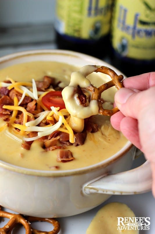 <p>Renee's Kitchen Adventures</p><p>This super easy-to-make beer cheese dip will be the hit of the party when served with your favorite pretzels, crackers or even celery sticks!</p><p><a href="https://www.reneeskitchenadventures.com/2018/12/beer-cheese-dip-with-bacon.html" rel="nofollow noopener" target="_blank" data-ylk="slk:Get the Recipe;elm:context_link;itc:0;sec:content-canvas" class="link ">Get the Recipe</a></p>