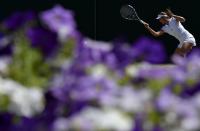 Garbine Muguruza of Spain hits the ball during a practice session at the Wimbledon Tennis Championships in London, July 10, 2015. REUTERS/Toby Melville